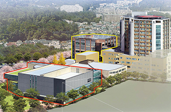 先端医療センター（手前の赤線で囲んだ建物）と外傷・救命救急センター（奥の黄線で囲んだ建物）の完成予想図
